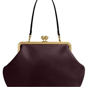 Coach, kisslock new w tags! Elegant Burgundy Handbag with Gold Accents